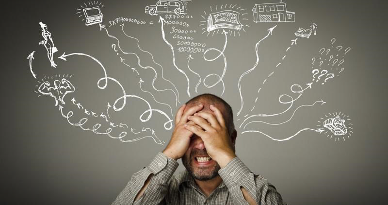 مردی که وسواس فکری به صورت تصاویر مختلف دور سرش کشیده شده است.